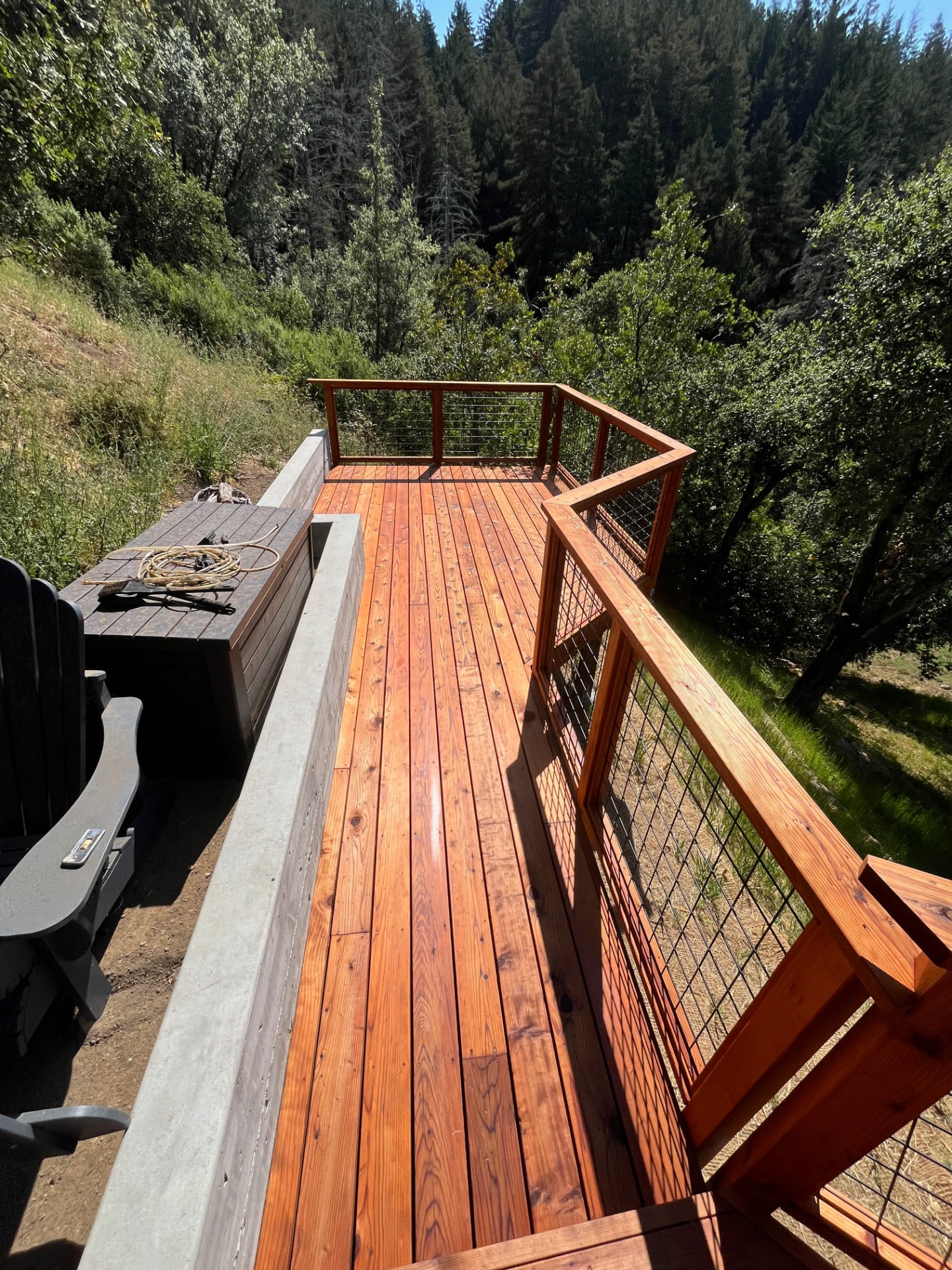 Freshly stained upper deck overlooking redwood forest