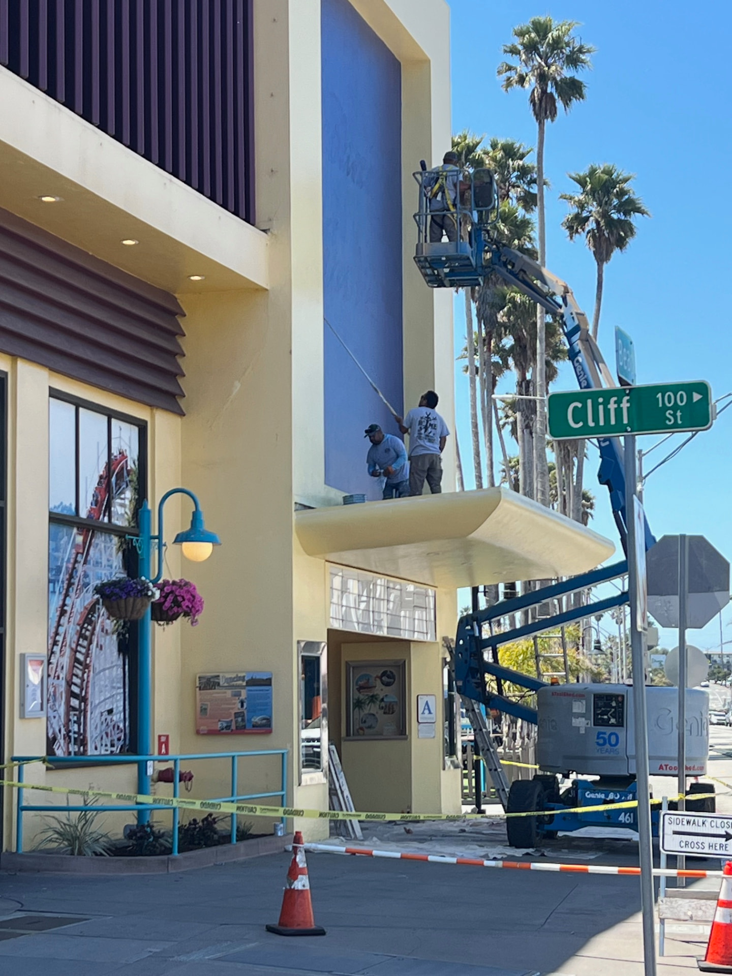 Crew rolling the upper facade on Cliff Street