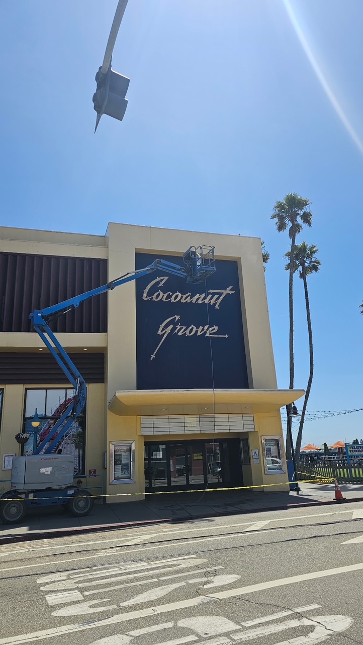 Boom lift positioned at the finished Cocoanut Grove wall